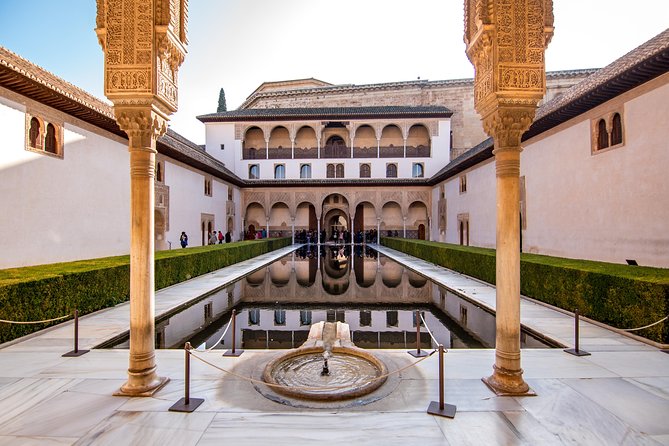 Alhambra and Nasrid Palaces Ticket with Audioguide - Collecting the ticket near Hotel Guadalupe
