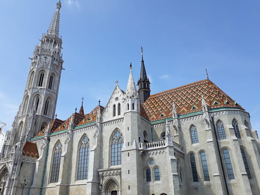 Budapest: Buda Castle Walking Tour & Folk Music Performance - Matthias Church and the story of King Matthias