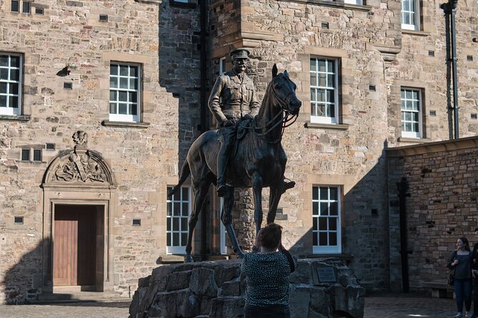 Edinburgh Castle Guided Walking Tour & Holyrood Palace Ticket - Castle Rock and the Royal Military Tattoo esplanade
