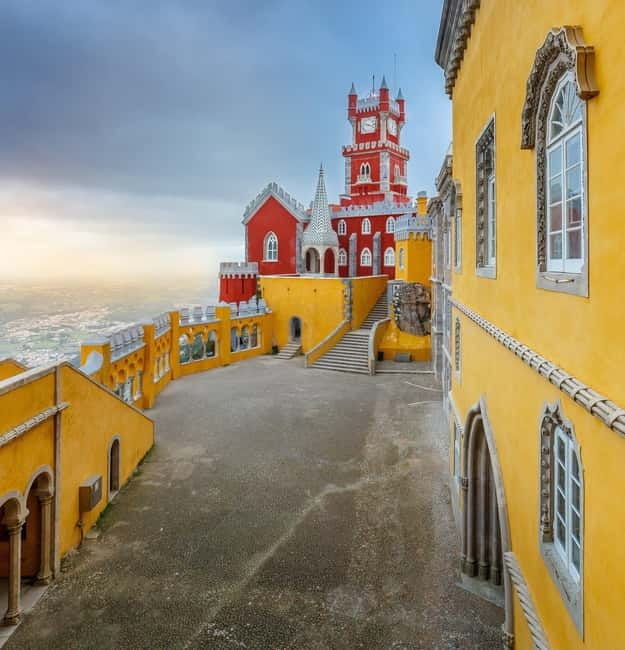 From Lisbon: Sintra and Estoril Trip with Pena Palace Entry - Entering Pena Palace above Sintra