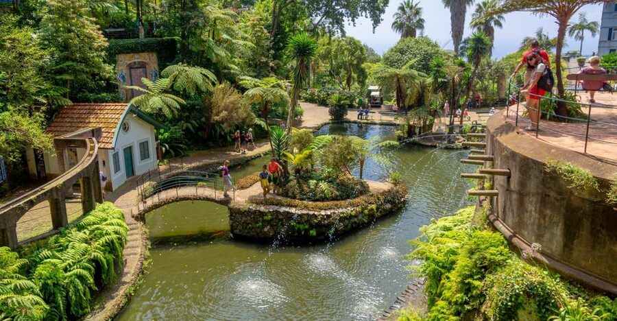 Funchal: Monte Palace Tropical Gardens Tuk Tuk Tour - Starting in Funchal and climbing toward Monte