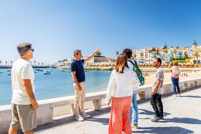 Lisbon: Sintra Cascais & Pena Palace Small Group Tour - Guincho Beach on the coastal drive
