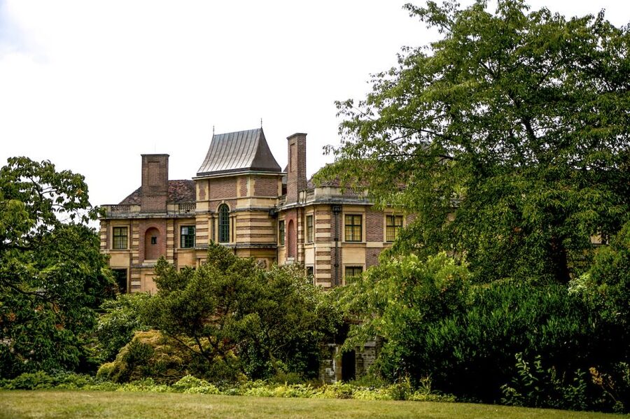 London: Entry Ticket to Eltham Palace and Gardens - The moat bridge, horses, and outdoor play area