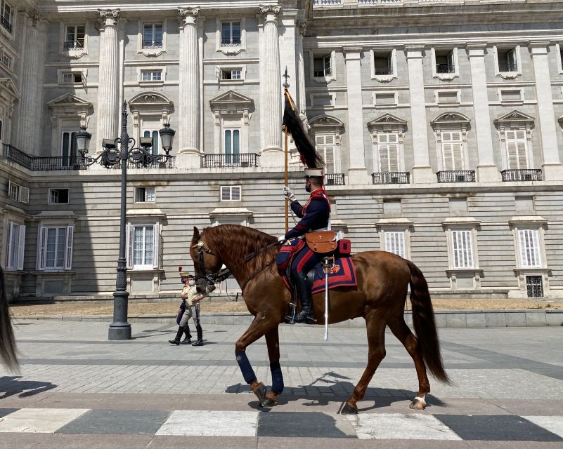 Madrid: Royal Palace Guided Shared Group Tour - The grand staircase sets the tone