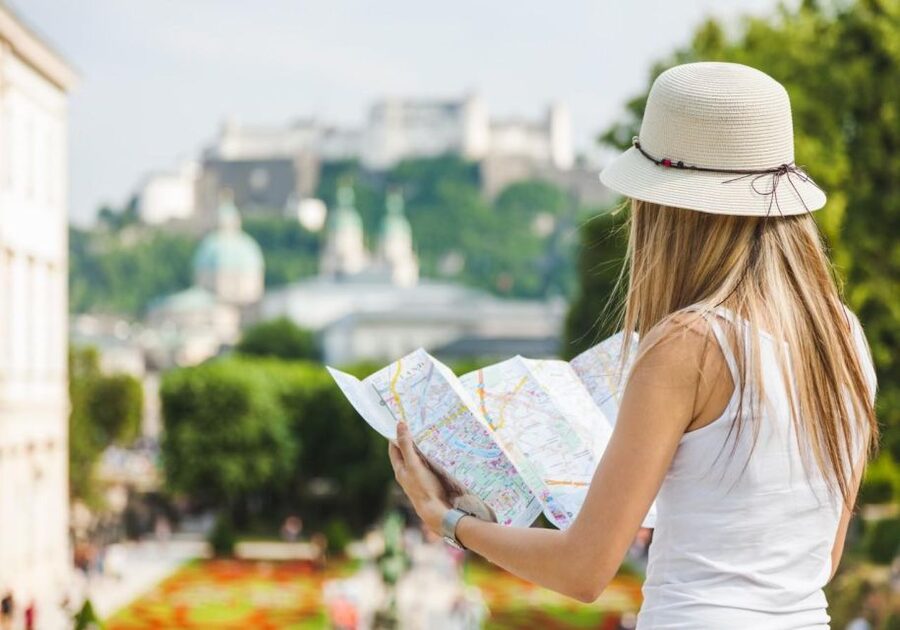 Salzburg: Old Town, Mozart, & Mirabell Gardens Walking Tour - Crossing the Salzach toward Mozart