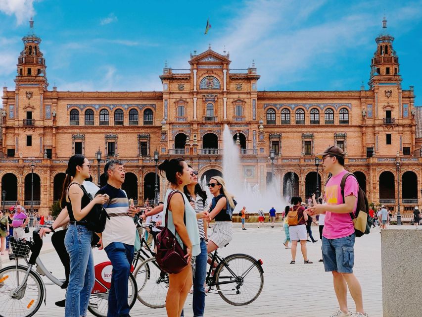 Seville FullDay Tour: Alcázar, Cathedral + Triana & Flamenco - Walking through Santa Cruz