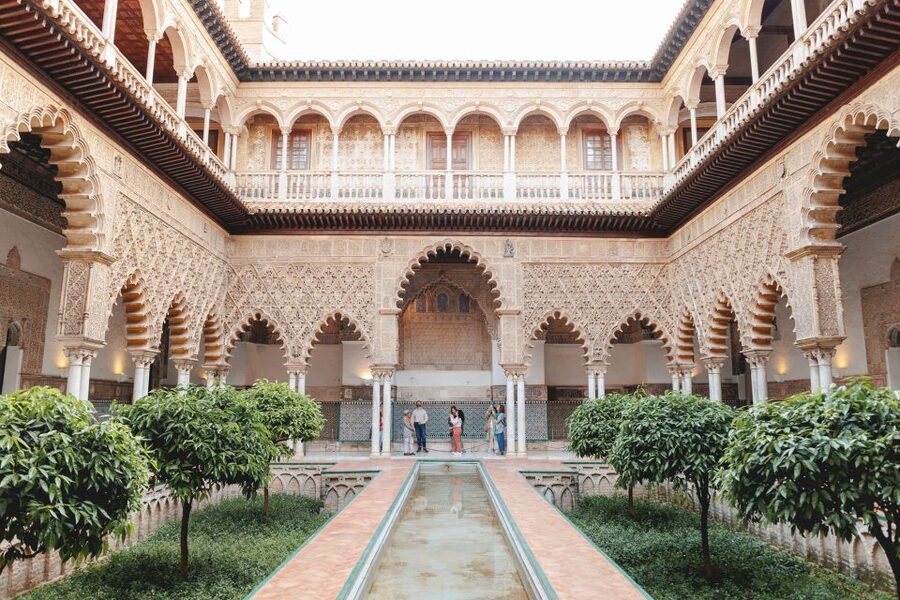 Seville: Guided Walking Tour with Alcazar & Cathedral Access - Santa Cruz turns a transfer into a history lesson