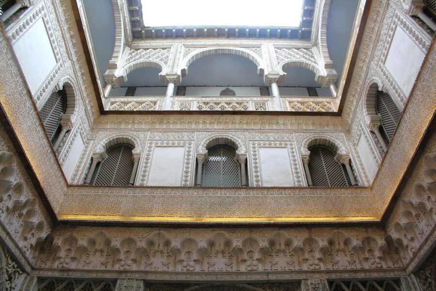 Seville: Royal Alcazar, Cathedral, and Giralda Tower Tour - Patio de los Naranjos and Seville’s grand squares