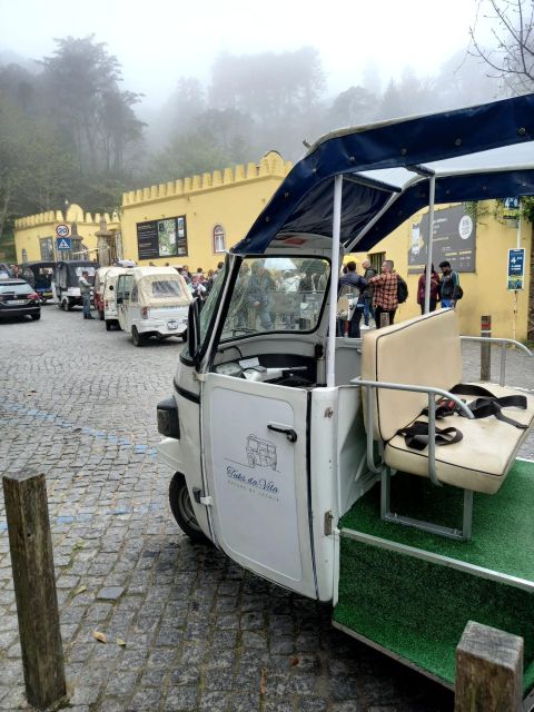 Sintra:1 hour tuk tuk experience to Pena Palace(3 monuments) - Sintra National Palace and the old town view